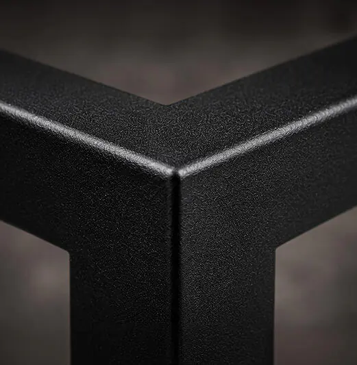 Close-up of a matte black edge made of powder-coated steel