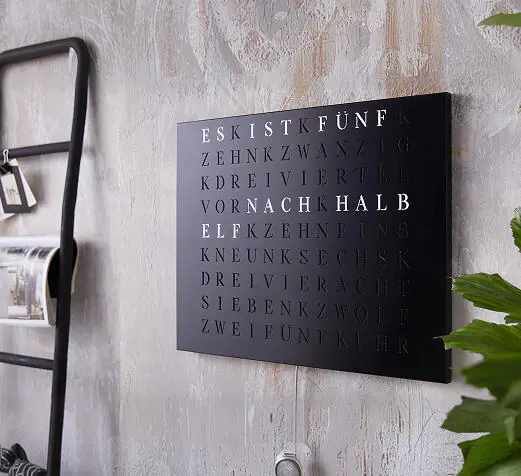 WordClock Jupiter on a textured wall with subtle light