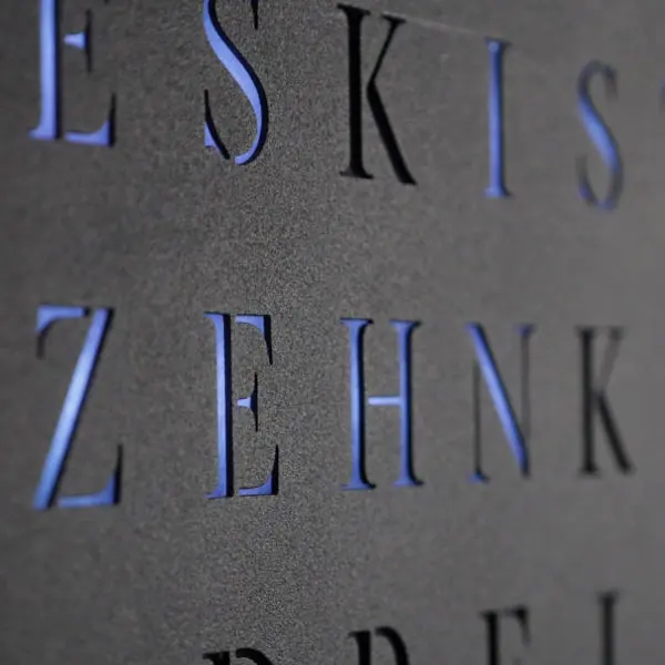 Close-up of the letters on the matte black WordClock Jupiter